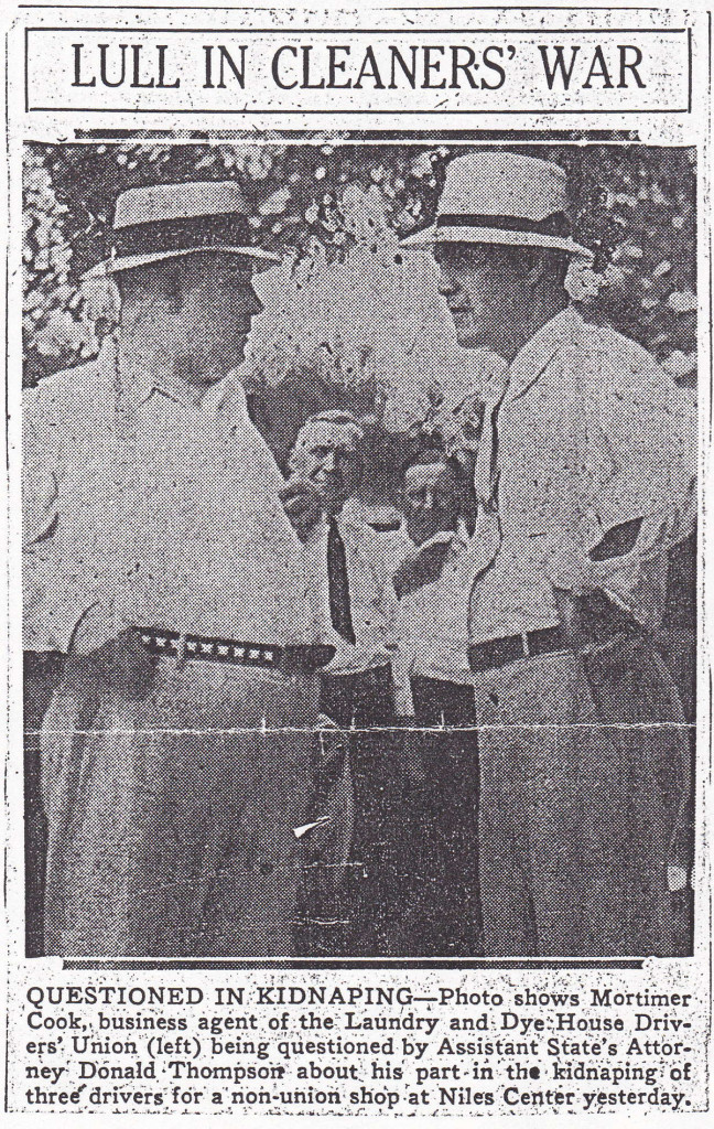 Two men in hats having a discussion.