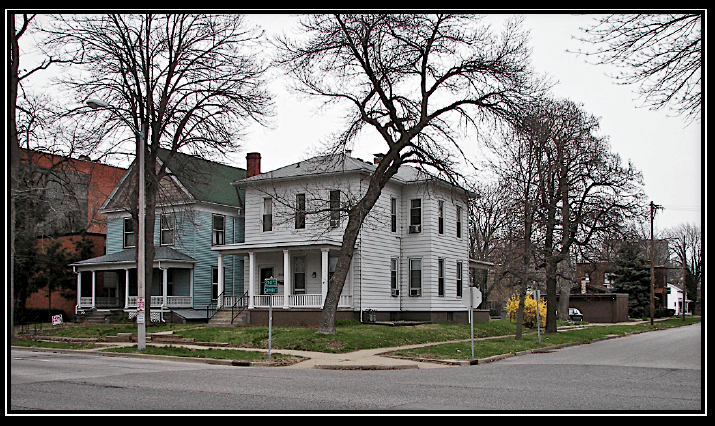 A house at the corner of a street intersection