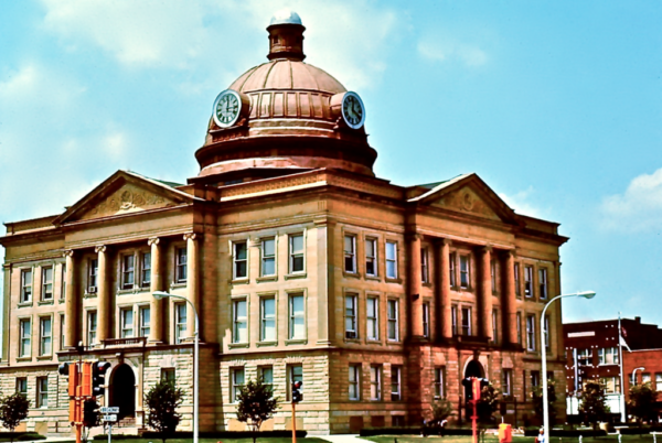 Historic courthouse with clock tower and dome.